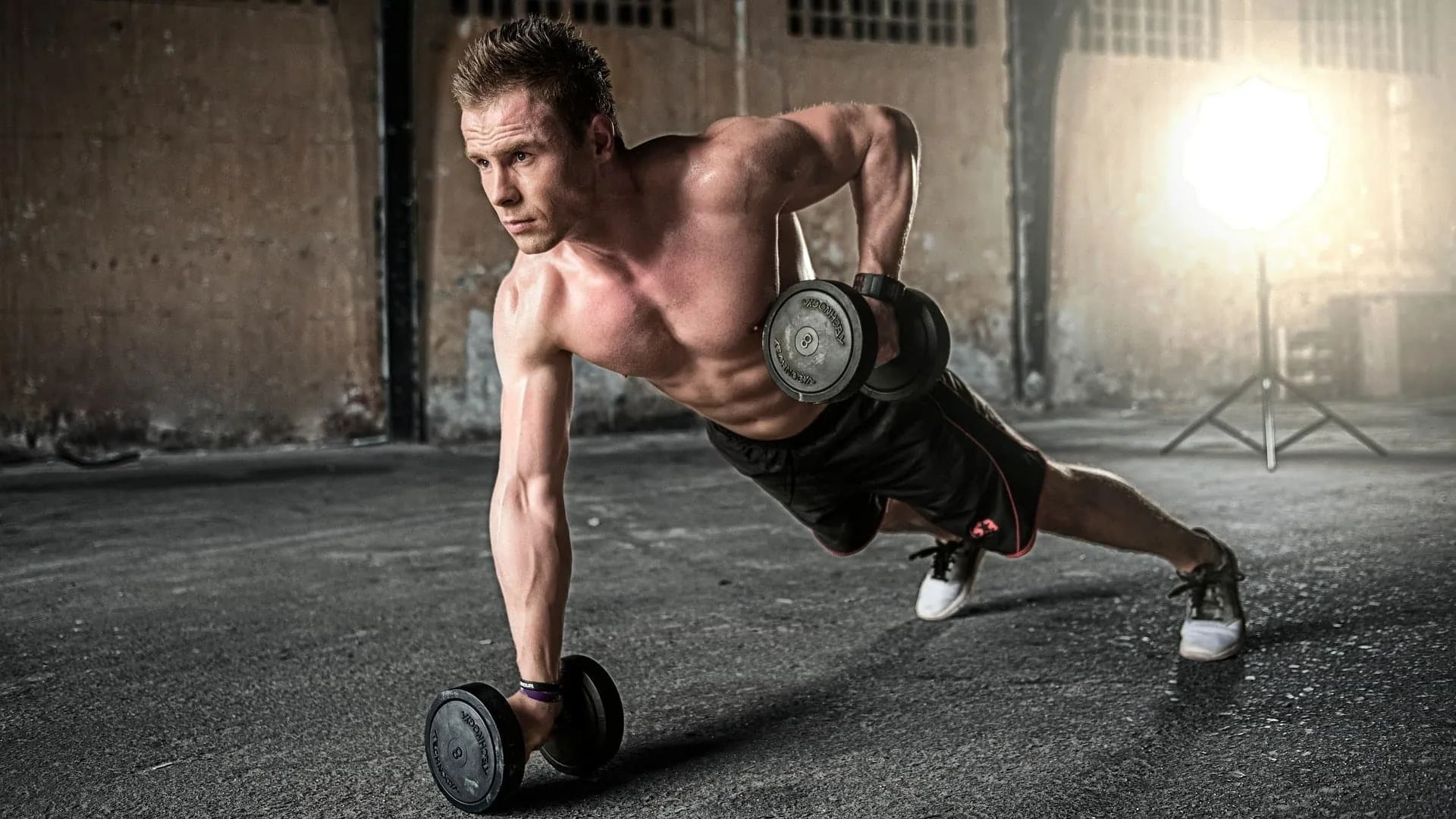Trainer coaching a client through a workout